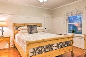 a bedroom with a wooden bed and a window at The Red Rock Retreat in Chimney Rock