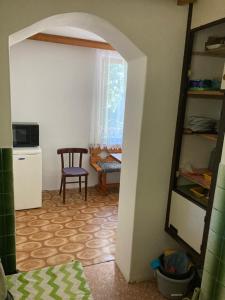 a room with a table and a chair in a room at Chata Chorche in Koloděje nad Lužnicí +16 photos