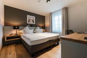 Postel nebo postele na pokoji v ubytování Hotel Friesenhof