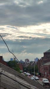 a view of a city with cars parked on a street at Edwardian House in Manchester