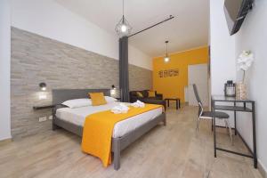 a bedroom with a king sized bed and a desk at Michele Lux Lodge 6 people Spotless and Connected to Airport and Vatican in Rome