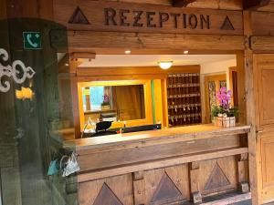 a wine shop with a sign that reads a reputation at Das Alpl Resort in Krieglach