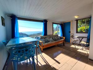 a living room with a couch and a table at Cabañas Vuelo de Gaviotas in Curanipe