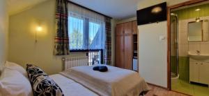 Posteľ alebo postele v izbe v ubytovaní Pokoje Apartamenty Pod Limbą
