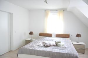 Postel nebo postele na pokoji v ubytování Ferienhaus Marina