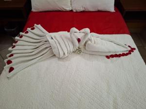 Postel nebo postele na pokoji v ubytování Hotel Tepoztlán