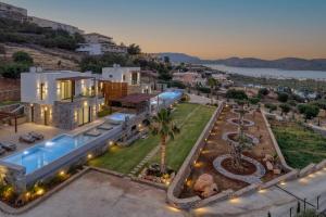 an aerial view of a house with a swimming pool at Zeus Luxury Villas in Elounda