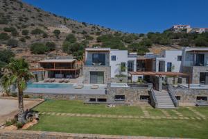 an image of a villa with a swimming pool at Zeus Luxury Villas in Elounda