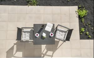 an overhead view of a table and chairs at Casa Paco in Orzola +4 photos