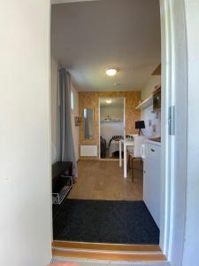 a room with a kitchen and a dining room at Huilikammari in Seinäjoki +13 photos