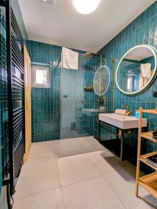 a bathroom with a sink and a mirror at Apartmán Masaryk in Český Krumlov