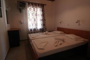 Posteľ alebo postele v izbe v ubytovaní White Rock Apartments
