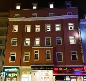a building on a city street at night at Boutique-Hotel Goethe in Munich