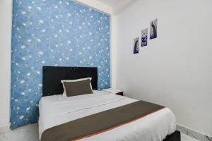 Postel nebo postele na pokoji v ubytování Hotel O Sawariya Regency