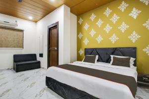 Postel nebo postele na pokoji v ubytování Hotel O Sawariya Regency