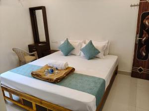 Postel nebo postele na pokoji v ubytování Saai Residency Tiruvannamalai