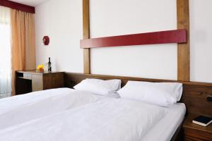 Postel nebo postele na pokoji v ubytování Hotel Pflug