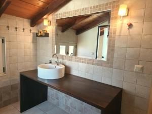 a bathroom with a sink and a mirror at Casa Evriali Apartments in Kokkíni Khánion +111 photos