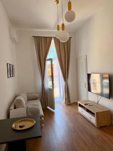 a living room with a couch and a table at La Perla Centre in Zagreb