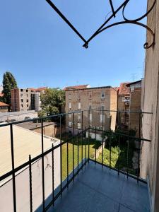 a balcony with a view of a courtyard at La Perla Centre in Zagreb
