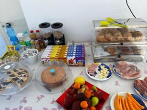 a table topped with lots of different types of food at Garden Gafè in Diamante