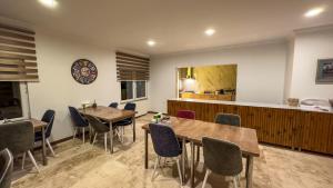 a restaurant with two tables and chairs and a kitchen at Casablanca Garden Hotel in Nevsehir +21 photos