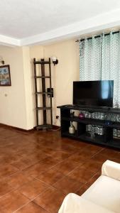 a living room with a large flat screen tv at Valley View in Saint George