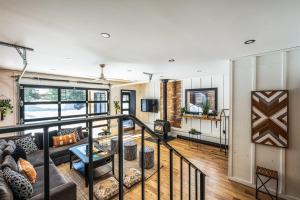 a view of a living room from the second floor of a house at FAMILIA - Lakefront Spa Nature near Mont Tremblant in Sainte-Lucie-de-Doncaster