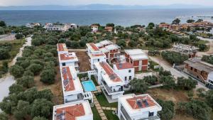 an aerial view of a house with the ocean at Mare Blue The Vintage Suite in Skala Rachoniou