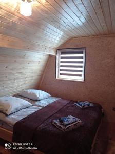 Postel nebo postele na pokoji v ubytování Садиба біля річки
