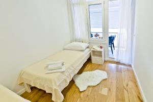 Posteľ alebo postele v izbe v ubytovaní Apartment Domalu Old Town + 37 fotografií