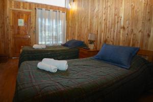 Postelja oz. postelje v sobi nastanitve Hostal Chumay