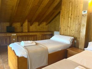 A bed or beds in a room at Casa Franch - L'Amfitriona