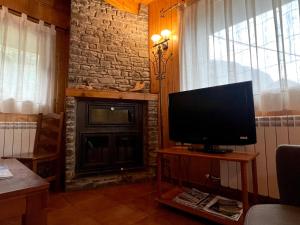 A television and/or entertainment centre at Casa Franch - L'Amfitriona