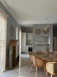 a kitchen and dining room with a table and chairs at Mare e Ricordi - Villa in Bari +29 photos