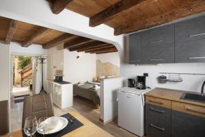 a kitchen with a sink and a counter top at Apartments Casa Antico in Premantura