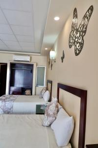 Uma cama ou camas num quarto em Hotel Yorio Inn