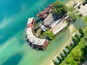 an aerial view of an island in the water at Overwater cottage - Slovak Tahiti, Senec in Senec +9 photos