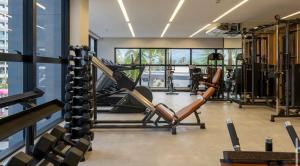 a gym with treadmills and exercise equipment in a building at Salinas Premium Resort in Salinópolis +6 photos