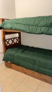 En eller flere senge i et værelse på Departamento centrico