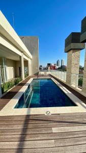 a swimming pool on the side of a building at Edificio Ventura Carmelitas in Asuncion