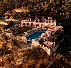 an aerial view of a mansion with a swimming pool at Chateau Fasel in Tirana