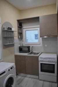 Η κουζίνα ή μικρή κουζίνα στο Sea Breeze House