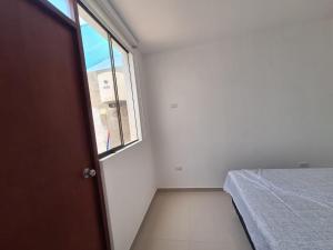 Ένα ή περισσότερα κρεβάτια σε δωμάτιο στο Casa privada EL REFUGIO SECRETO