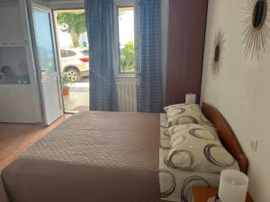 Postel nebo postele na pokoji v ubytování Apartments Nevenka i Josko