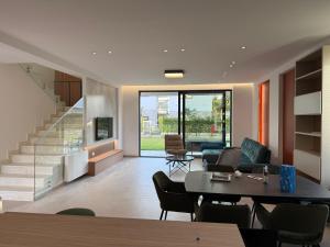 a living room with a couch and a table at BelVilla in Lalzit Bay