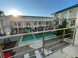 a view of the courtyard of a hotel with a swimming pool at OSTRIV Hotel in Zatoka