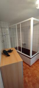 a bathroom with a counter with a phone on it at Casa do Carvoeiro in Fundão +55 photos