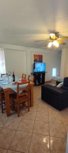 a living room with a table and a couch at Casa do Carvoeiro in Fundão