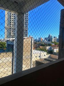 a view of the city from a window at Apto compacto para familia in Fortaleza